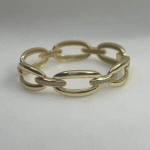 Esclava de plata chapada en oro amarillo eslabones unidos con tira engastada de circonitas.